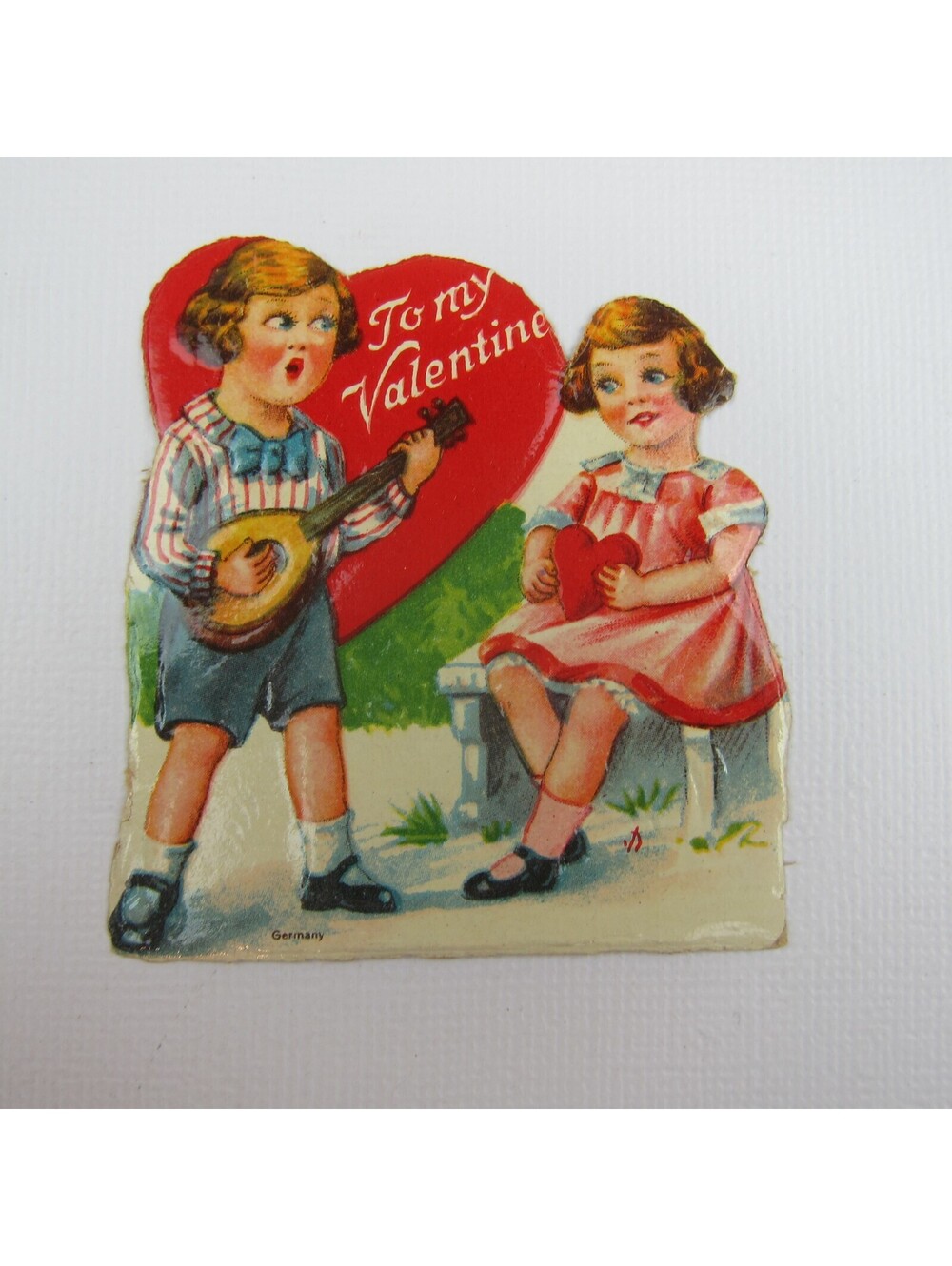 Vintage Valentine Die cut Boy Plays Mandolin for Girl Pink Dress Red Hearts
